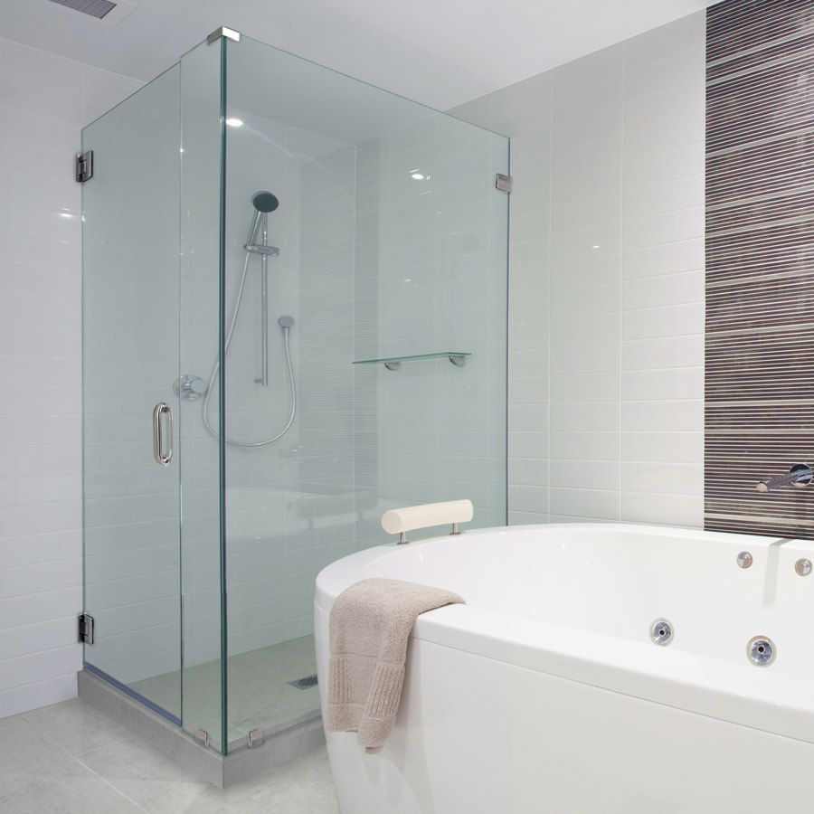 Bathroom interior, including bathtub and clear separate shower.